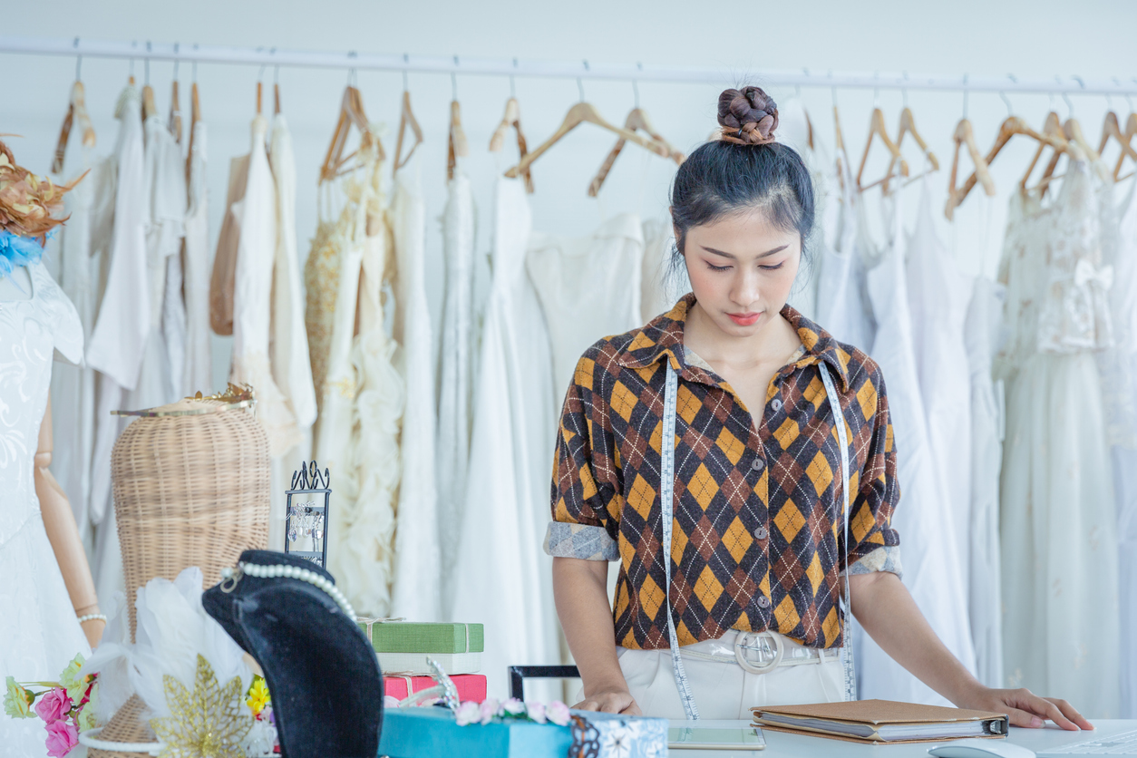 Clothing designer woman working in her small business office